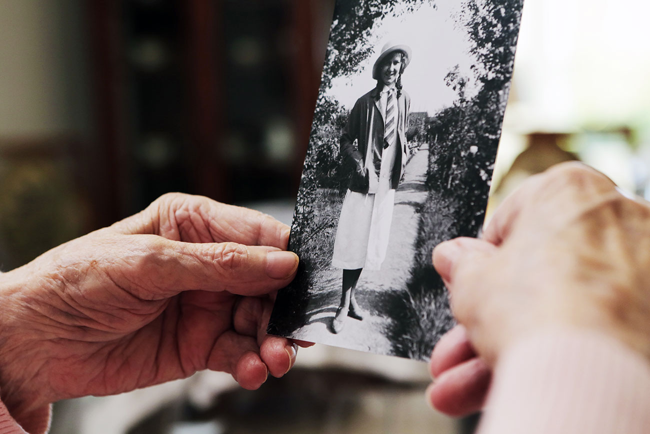 Older-person-holds-an-old-photograph-symbol-for-memories-and-memory-loss-in-Alzheimer’s-dementia